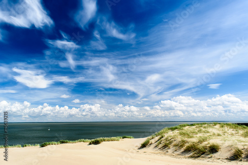 Spectacular landscape. Deep blue sky and sailing ship in the ocean