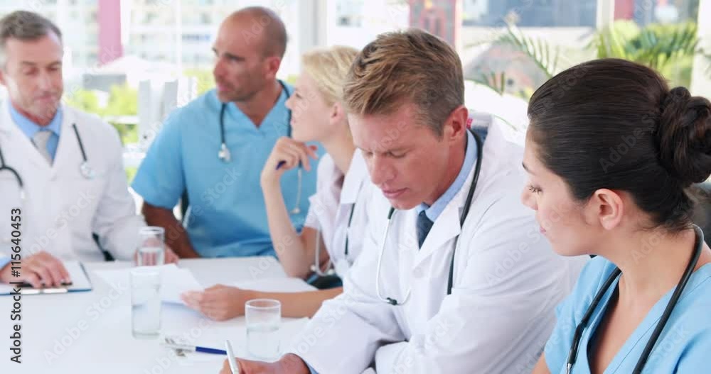 Video of medical team working together during meeting Video of medical team working together during meeting