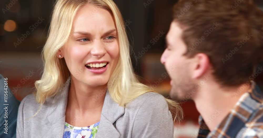 Happy hipster friends discussing together Happy hipster friends discussing together
