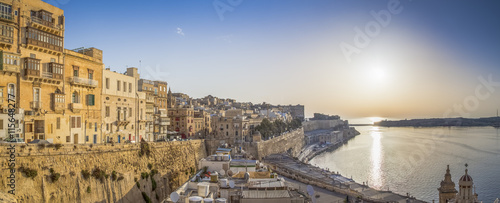 Valletta, Malta - Panoramic skyline view of the ancient walls and houses of Valletta at sunrise