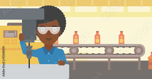 Woman working on milling machine.