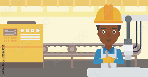 Woman working on industrial drilling machine.