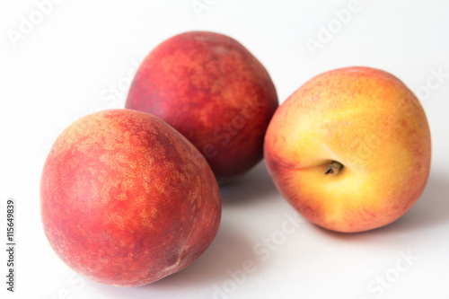 Ripe juicy peach isolated on white