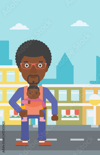 Father carrying his daughter in sling.