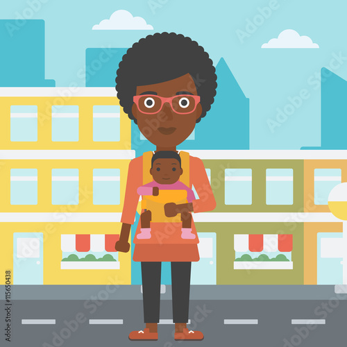 Mother carrying her son in sling.