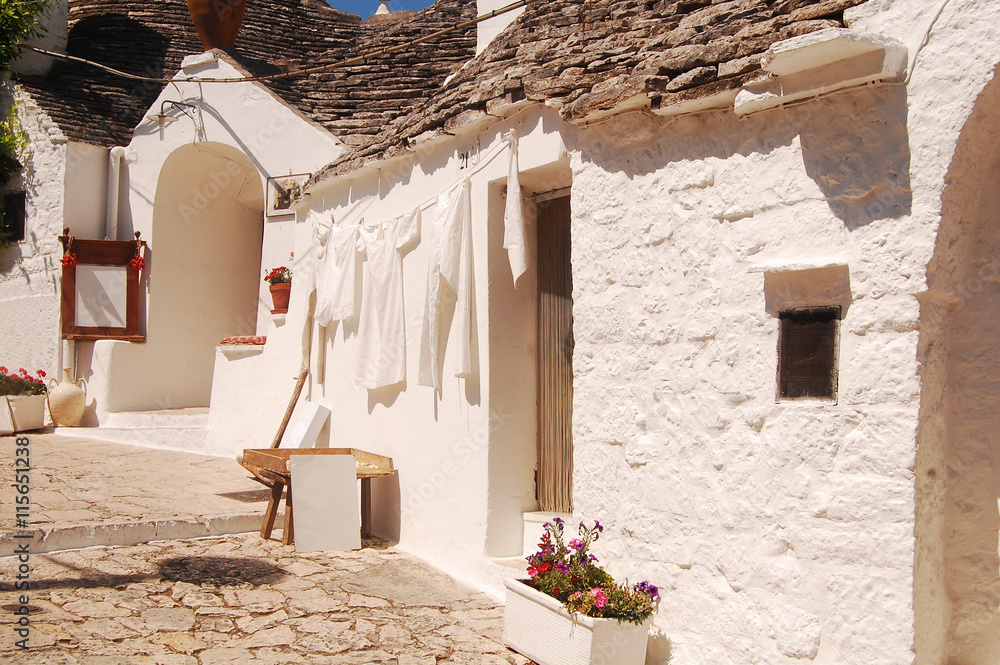 A characteristic square of Alberobello with its famous Trulli -