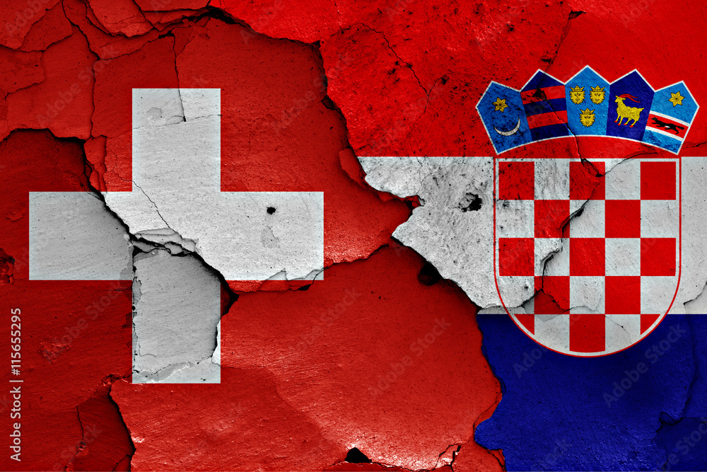 flags of Switzerland and Croatia painted on cracked wall