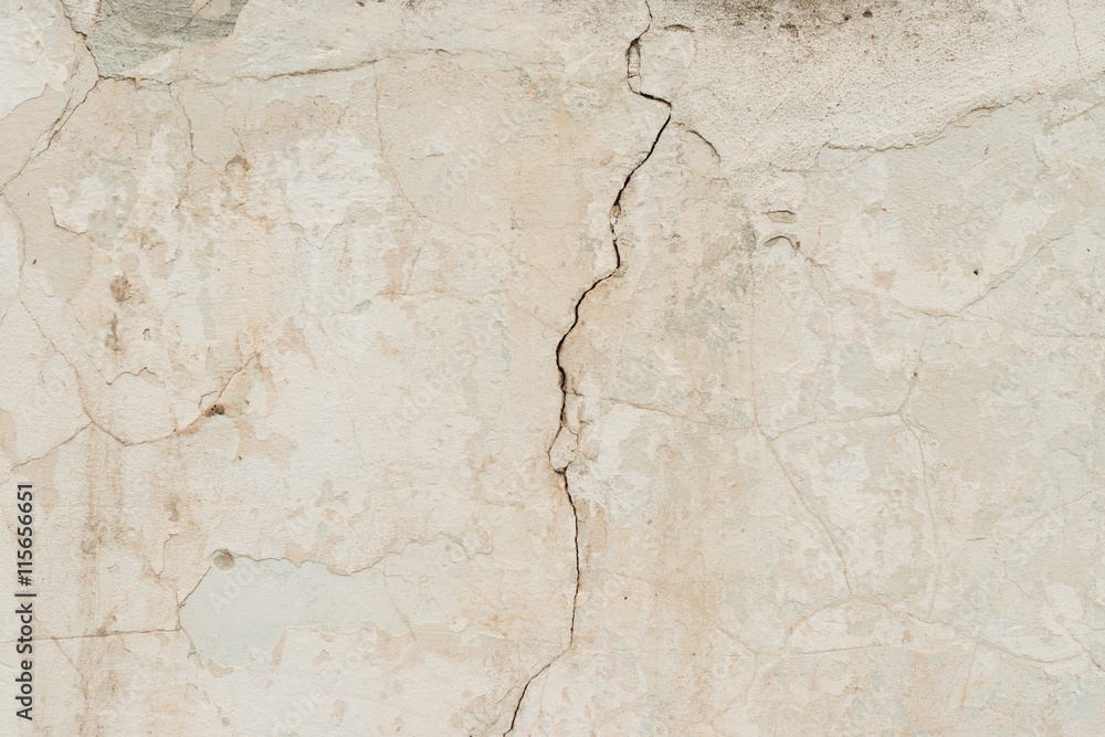 Fototapeta premium Wall fragment with scratches and cracks