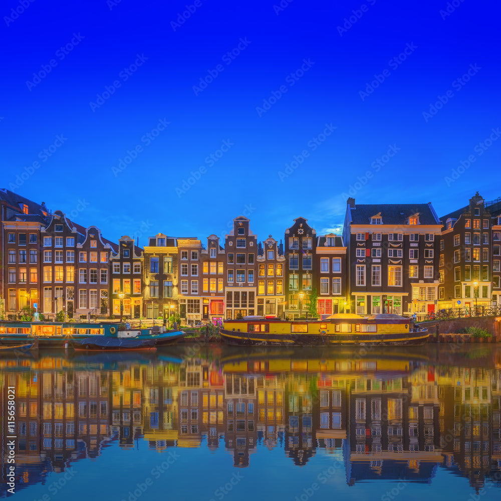 Amstel river, canals and night view of beautiful Amsterdam city. Netherlands