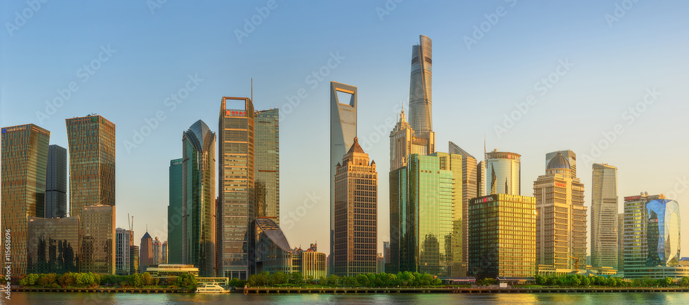 Cityscape of Shanghai and Huangpu River on sunset, beautiful reflection on skyscrapers, China