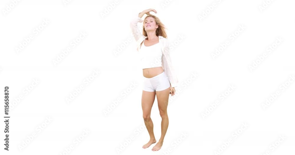 Pretty blonde moving and smiling on white background Pretty blonde moving and smiling on white background