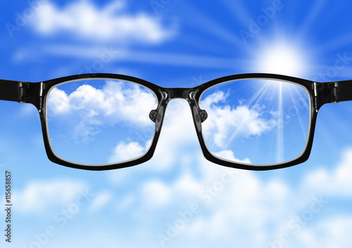 very blurry sky and glasses with blue sky
