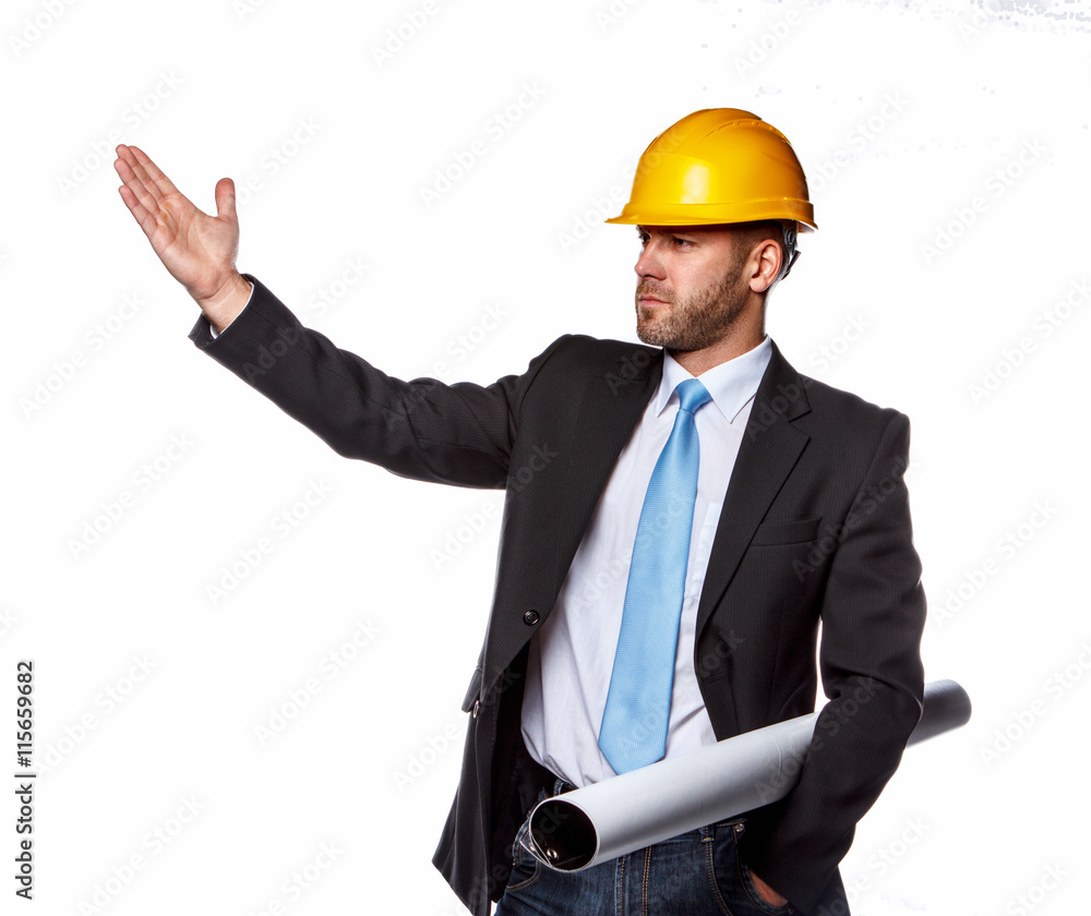 A man in a suit and safety yellow helmet. A man in a suit and safety yellow helmet.
