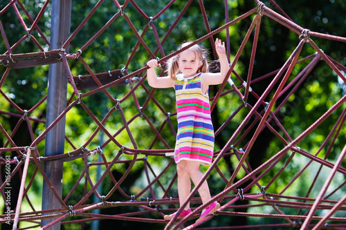 Child having fun on school yard playground © famveldman