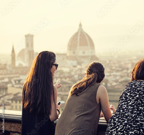People at sunset watching the view of Florence. photo