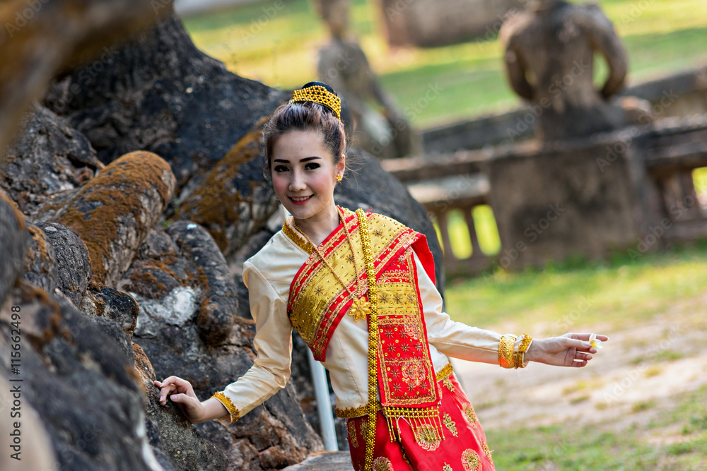 Fototapeta premium Beautiful woman at Thailand traditional dress in temple.