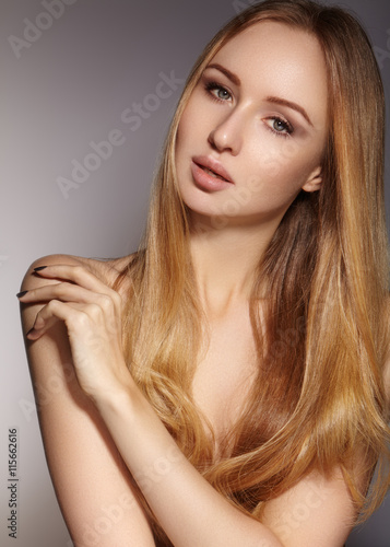 Beautiful young woman with clean skin, beautiful straight shiny hair, fashion makeup. Glamour make-up, perfect shape eyebrows. Portrait sexy blondy. Beautiful smooth hairstyle. Shiny nail polish