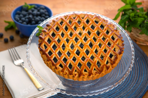 Whole homemade fresh blueberry organic pie tart golden crust fruit filled delicious dessert