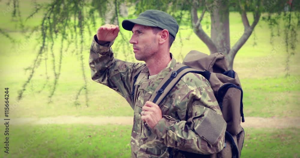 Serious soldier looking away with hand on forehead Serious soldier looking away with hand on forehead