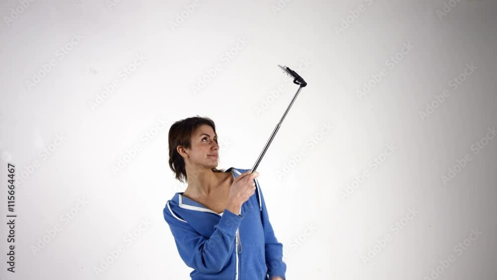 Pretty girl taking selfie with stick in ultra hd format Pretty girl taking selfie with stick in ultra hd format