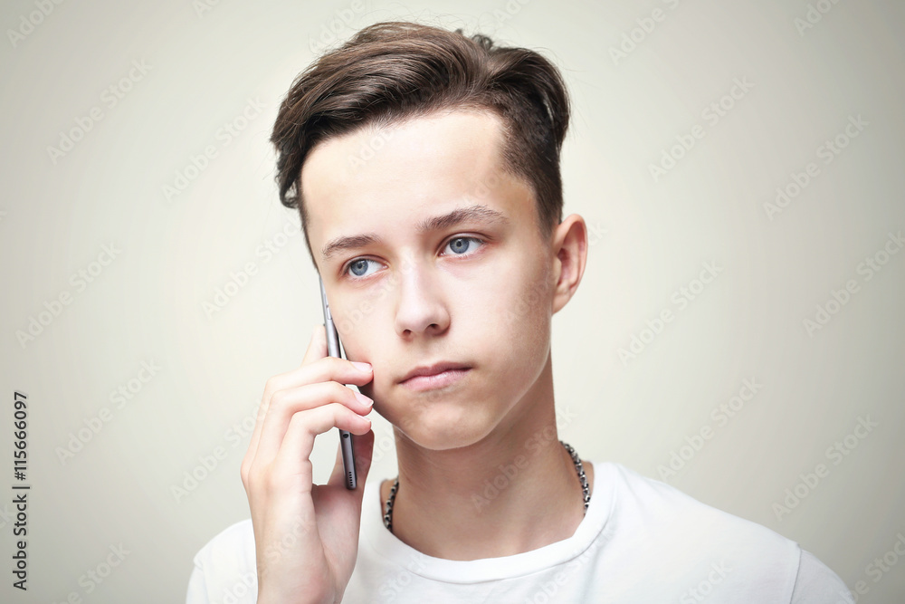 Young handsome man calls by mobile telephone Young handsome man calls by mobile telephone