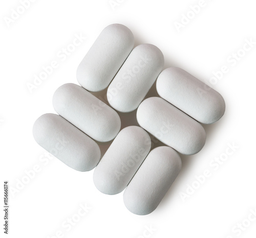White oval pills isolated on white