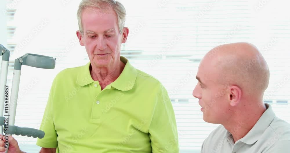 Doctor examining his patient knee Doctor examining his patient knee