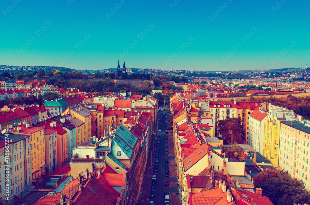 Fototapeta premium View to the Vysegrad in Prague, Czech Republic at autumn with cathedral and red roofs, travel seasonal vintage hipster background