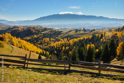 Colorful autumn landscape in the mountain village Magura, morning in the Carpathian mountains. Romania, Europe.