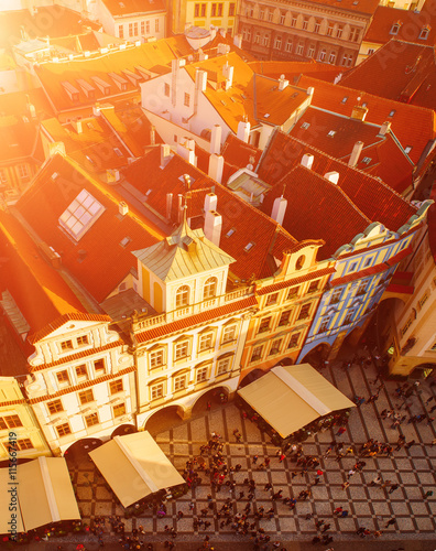Red Prague roofs and square with lot of small people - view from the City Hall, travel european sunny background © Roxana