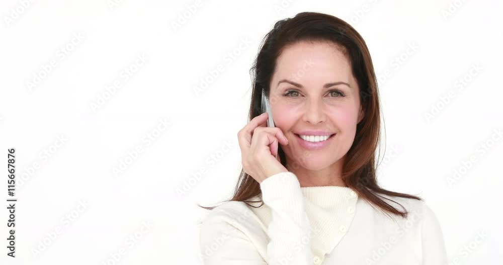 Smiling woman having a phone call on white background Smiling woman having a phone call on white background