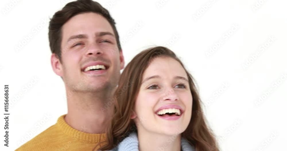 Smiling young couple hugging on white background Smiling young couple hugging on white background
