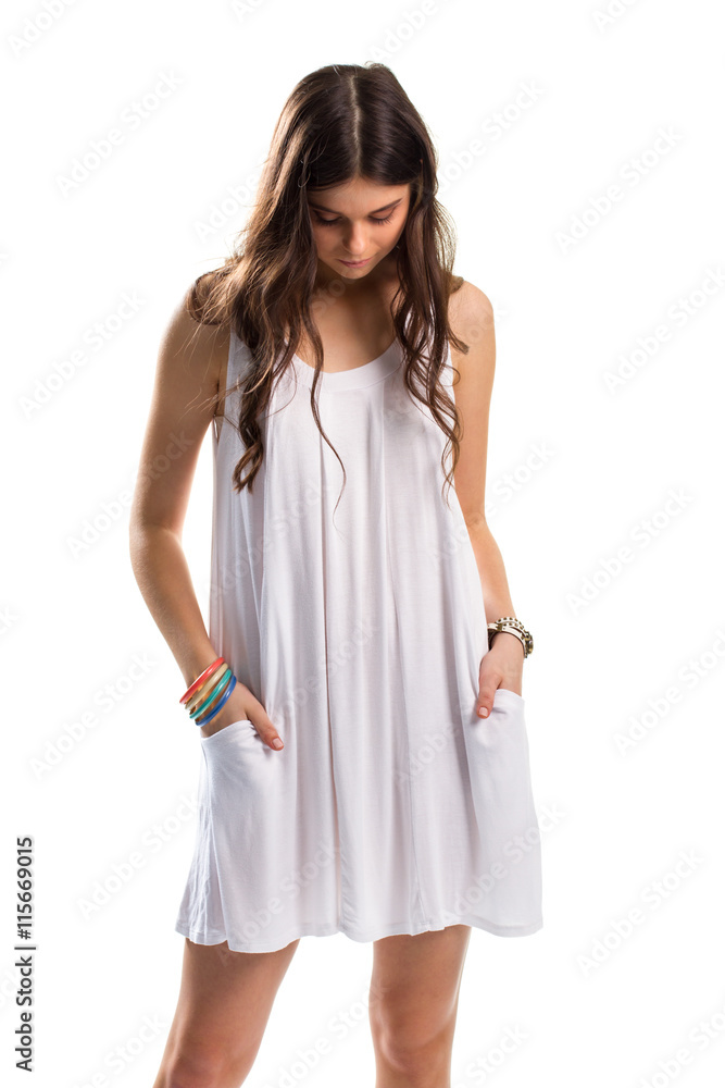 Woman in sarafan looks down. Set of colorful bracelets. Sad model on white background. Moment of sorrow. Woman in sarafan looks down. Set of colorful bracelets. Sad model on white background. Moment of sorrow.