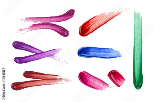 set of various lipstick and nail polish strokes on white background