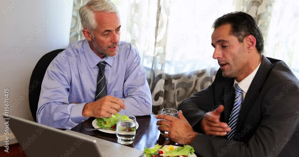 Businessmen having a working lunch Businessmen having a working lunch
