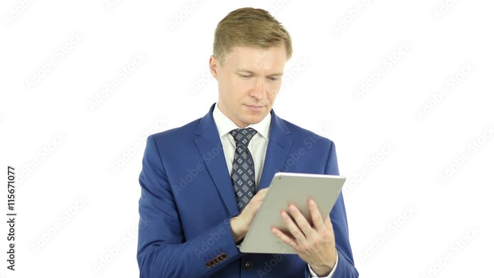 Businessman using a tablet computer - isolated over a white background Businessman using a tablet computer - isolated over a white background