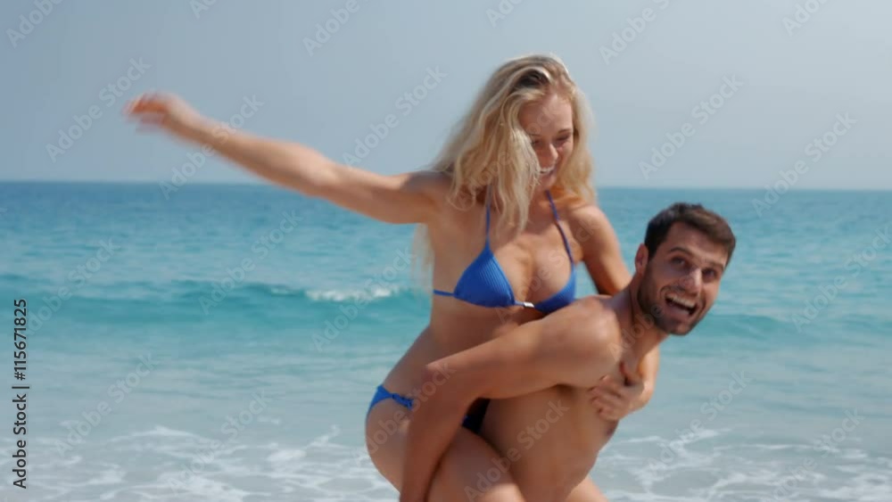 Video of handsome man doing piggy-back to his girlfriend Video of handsome man doing piggy-back to his girlfriend