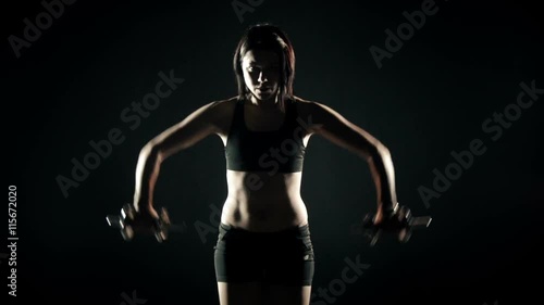 Wallpaper Mural  beautiful woman training with dumbbells Torontodigital.ca