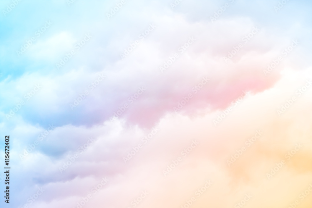 Rainbow Clouds. A soft cloud background with a pastel colored orange to  blue gradient. Stock Photo