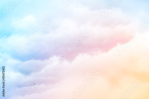 Rainbow Clouds.  A soft cloud background with a pastel colored orange to blue gradient. © DavidMSchrader