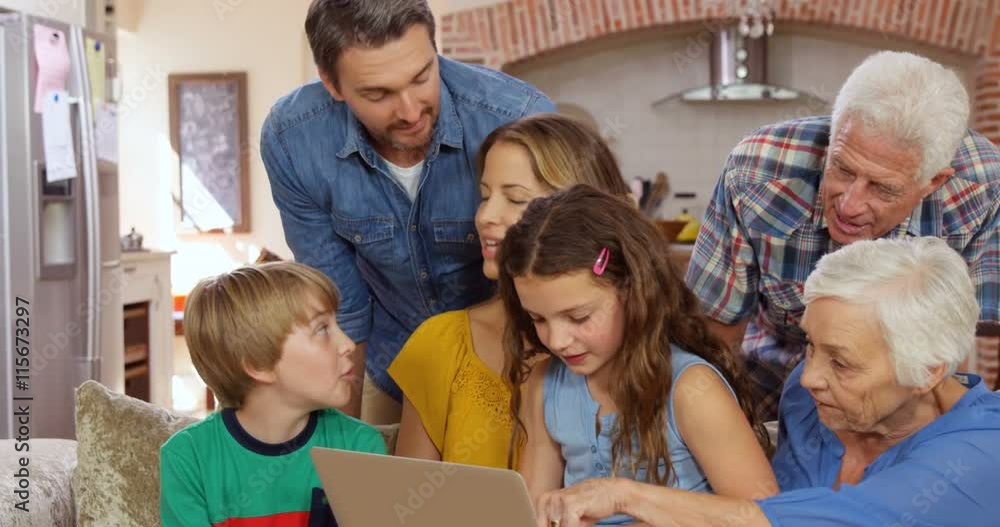 Multi generation family using laptop Multi generation family using laptop