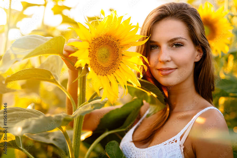 Beautiful woman surrounded by sunflowers Beautiful woman surrounded by sunflowers