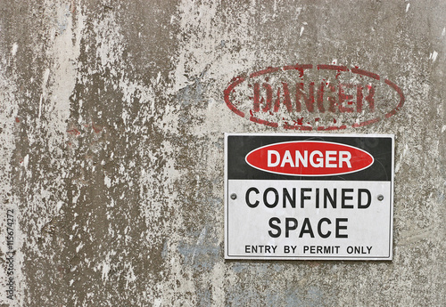 red, black and white Danger, Confined Space warning sign photo