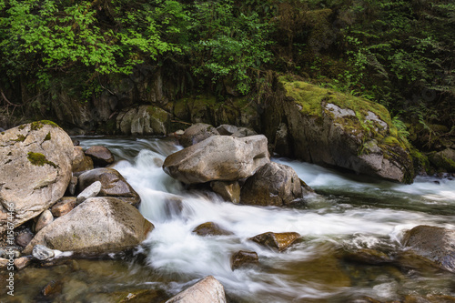 Peaceful waterfall with running river around the rocks in the canyon of British Columbia  Canada.