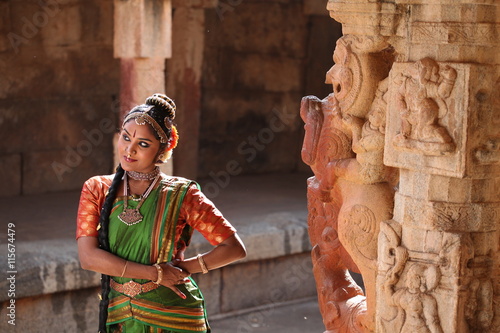 kuchipudi is one of the classical dance forms of india,belongs to state andhra pradesh.here the dancer poses at bhoga nadeeshwara temple near bangalore photo