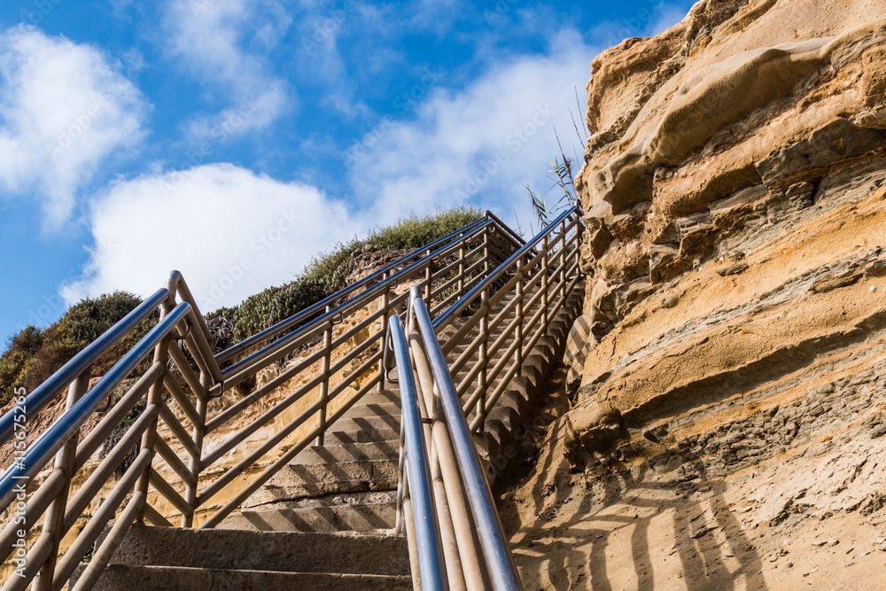 Beach access staircase, view looking up with cliff, Ladera Street, Sunset Cliffs, San Diego, California. Beach access staircase, view looking up with cliff, Ladera Street, Sunset Cliffs, San Diego, California.