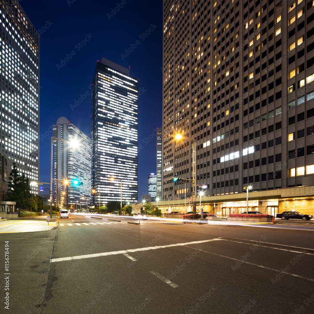 traffic on road in downtown of tokyo at night