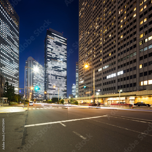 traffic on road in downtown of tokyo at night