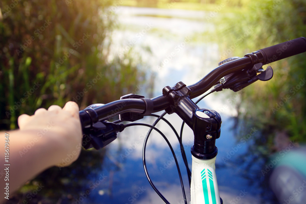 Hand on handlebars of a bicycle Hand on handlebars of a bicycle