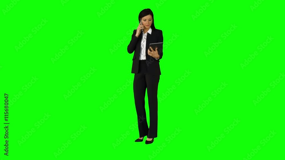 Businesswoman having phone call on green screen Businesswoman having phone call on green screen